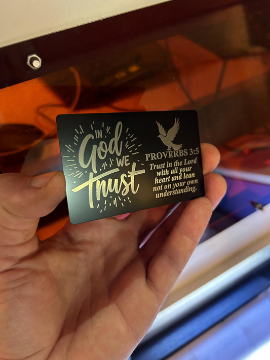 black/silver metal card with 'In God We Trust' and Proverbs 3:5 text.