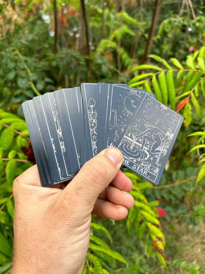 deck of metal tarot cards in matte/black silver