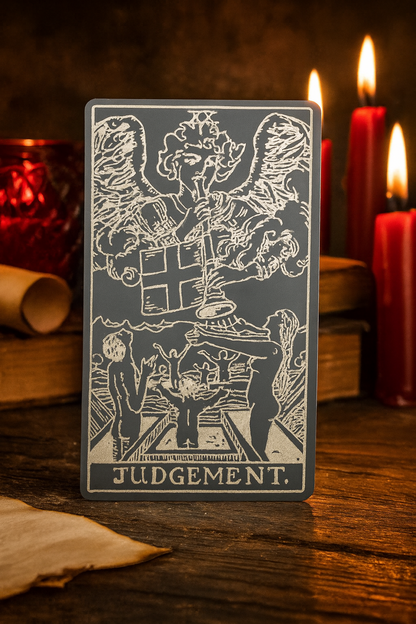 Tarot card titled 'Judgement' with candles and books in the background