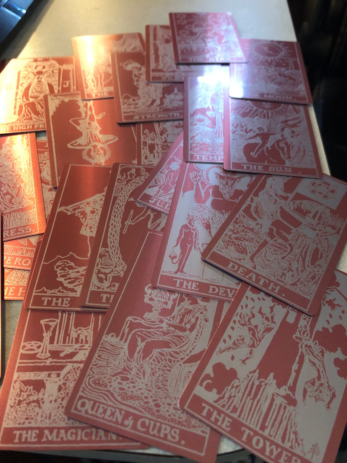 Laser engraved metal tarot card deck in rose gold/silveer