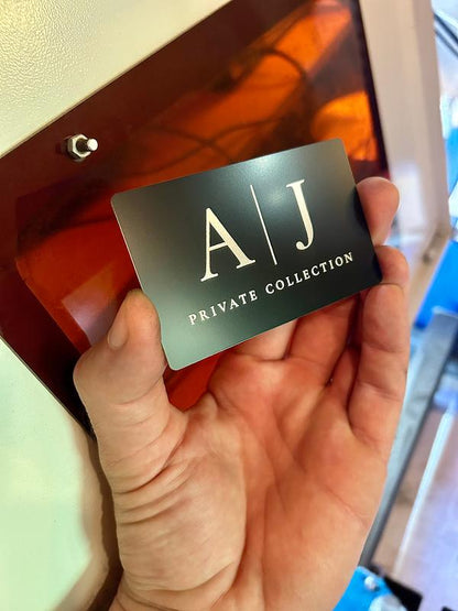 Laser engraved metal business card with private collection engraving in black/silver anodized aluminum