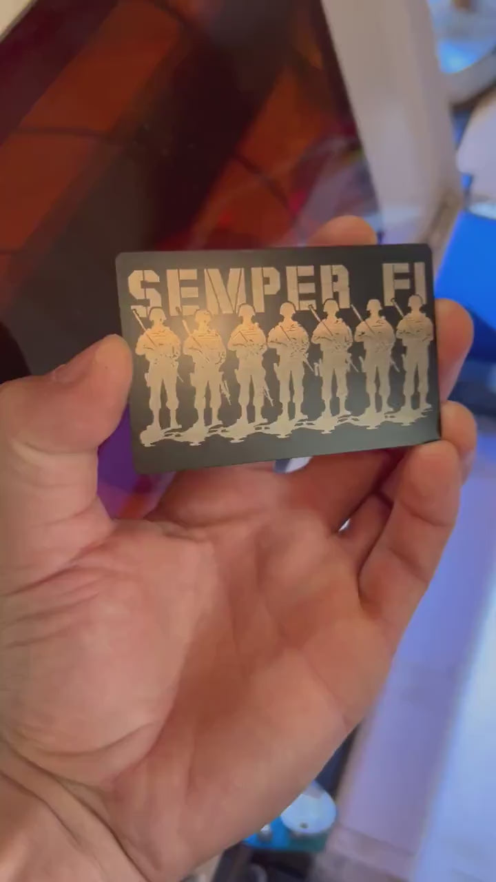 Video of engraved metal wallet card turning under light to show reflective finish of semper fi military platoon artwork