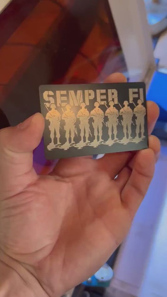 Video of engraved metal wallet card turning under light to show reflective finish of semper fi military platoon artwork