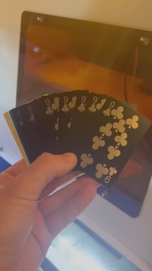 Video of and holding a run of 9 of clubs metal playing cards for a client celebrating 9th birthday party favor gift