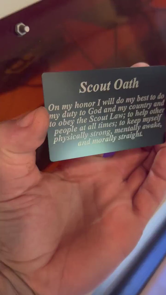 Video of hand holding the metal Scout Oath laser engraved keepsake card, with close up demonstrating text and reflective properties of the commemorative card
