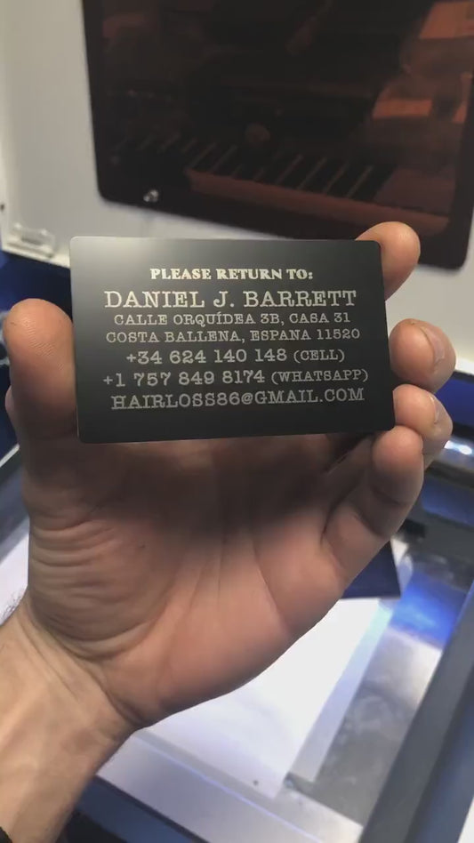 Personalized metal luggage tag with example text engraving