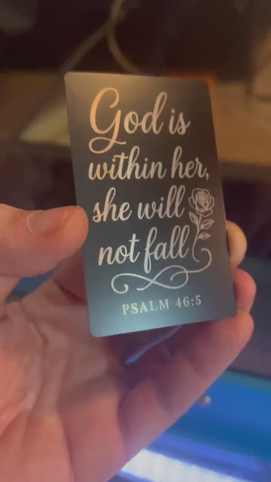 Laser engraved metal keepsake card that reads in elegant typography: God Is Within Her, She Will Not Fall, with a bible verse reference for Psalm 46:5 below