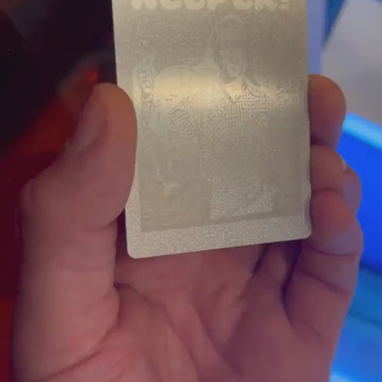 Silver on silver laser engraved metal business card, with customized text and image logo