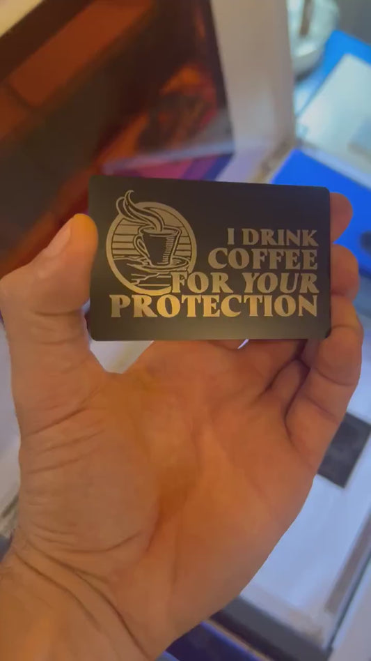 Video of engraved metal coffee protection funny novelty gift card turning under light to show reflective finish