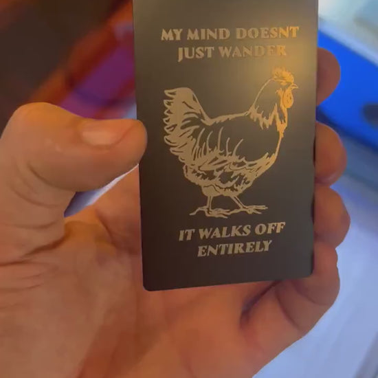 laser engraved metal gift card that reads "My Mind Doesn't Just Wander, It Walks off Entirely" with silly farmhouse chicken graphic graphic
