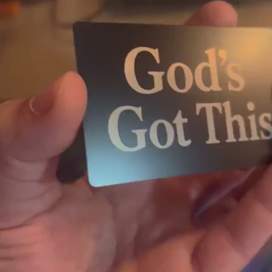 Laser engraved metal faith inspired motivational keepsake that reads "God's Got This" in classic lettering, in black/silver anodized aluminum