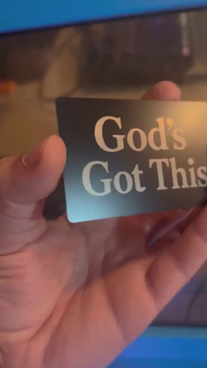 Laser engraved metal faith inspired motivational keepsake that reads "God's Got This" in classic lettering, in black/silver anodized aluminum