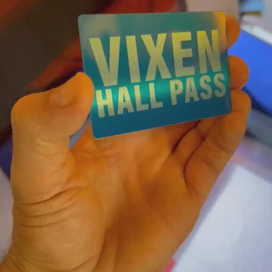 Close up video of hand holding a laser engraved metal gift card with personalized text and hall pass card shown in blue/silver