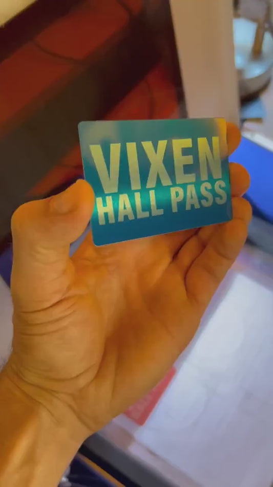 Close up video of hand holding a laser engraved metal gift card with personalized text and hall pass card shown in blue/silver