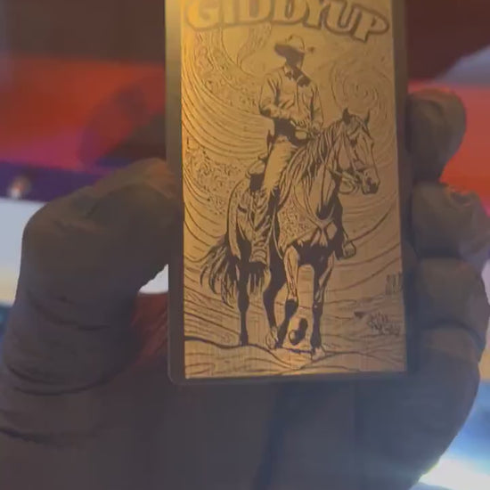 Video of engraved metal Giddyup country western wallet card turning under light to show reflective finish