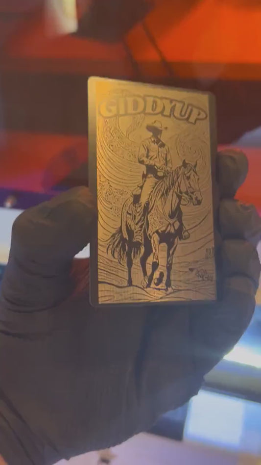 Video of engraved metal Giddyup country western wallet card turning under light to show reflective finish