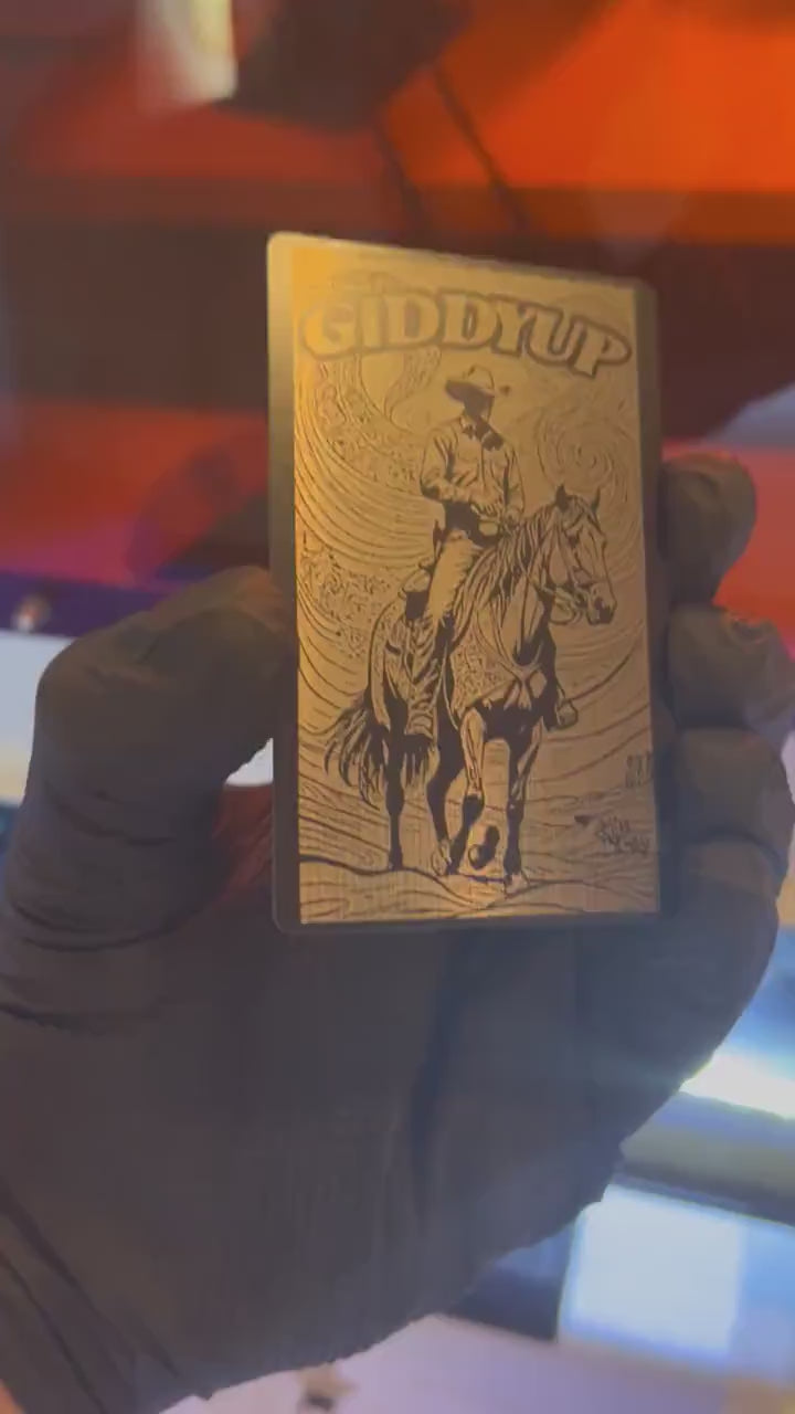 Video of engraved metal Giddyup country western wallet card turning under light to show reflective finish