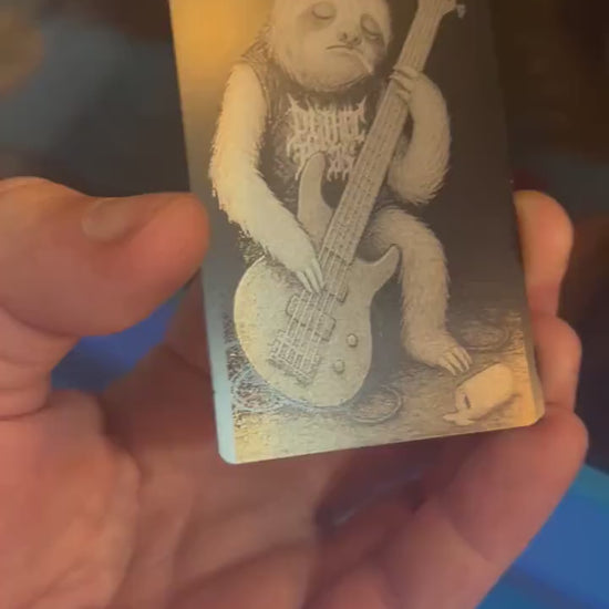 Laser engraved metal novelty gift card for musicians, with a rocker Sloth bassist on a stage with spilled beer can and cigarette
