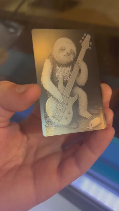 Laser engraved metal novelty gift card for musicians, with a rocker Sloth bassist on a stage with spilled beer can and cigarette