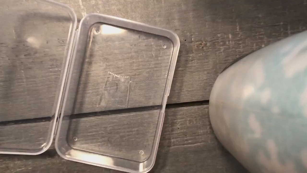 Video of metal tarot cards being put into a protective shipping case one after the other, demonstrating multiple metal tarot card designs