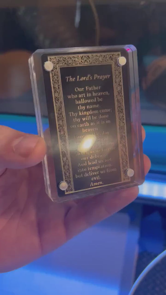 Laser engraved metal "The Lord's Prayer" flash card, shown in black/silver anodized aluminum with optional acrylic display case