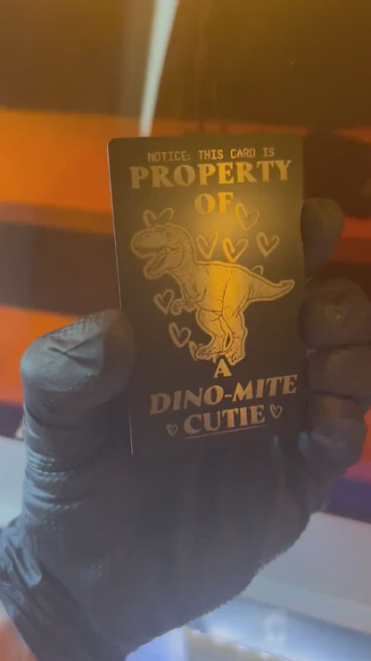 Video of engraved metal property of a cutie wallet card turning under light to show reflective finish
