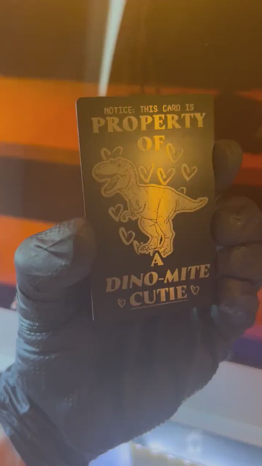 Video of engraved metal property of a cutie wallet card turning under light to show reflective finish