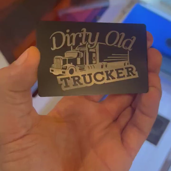 Video of engraved metal Dirty Old Trucker sarcastic gift wallet card turning under light to show reflective finish