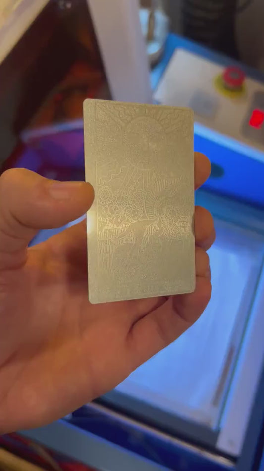 Custom anodized aluminum card being rotated to highlight the tarot card design