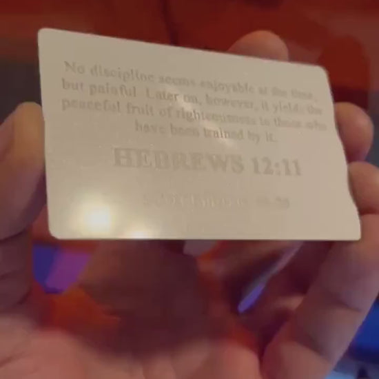 Laser engraved white and silver anodized aluminum business card, with personalized text engraving