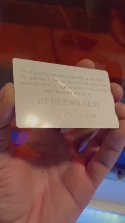 Laser engraved white and silver anodized aluminum business card, with personalized text engraving