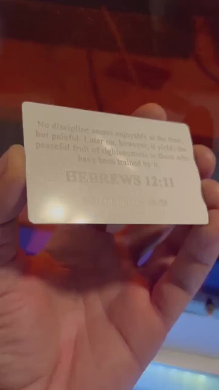 Laser engraved white and silver anodized aluminum business card, with personalized text engraving