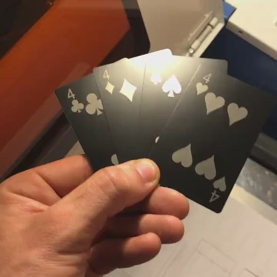 Custom anodized aluminum metal playing card #4 being rotated to highlight the four of spades, four of diamonds, 4 of spades and 4 of hearts cards