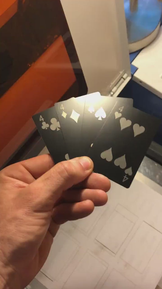 Custom anodized aluminum metal playing card #4 being rotated to highlight the four of spades, four of diamonds, 4 of spades and 4 of hearts cards