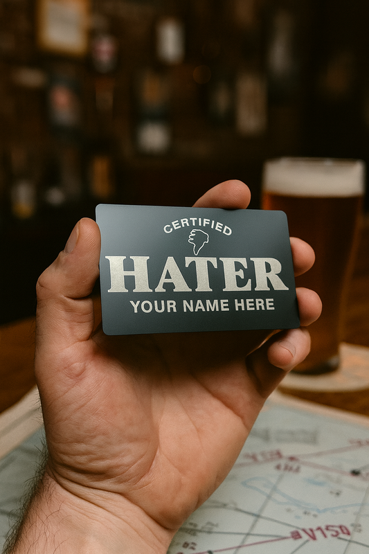 Hand holding a 'Certified Hater' card with a blurred bar background