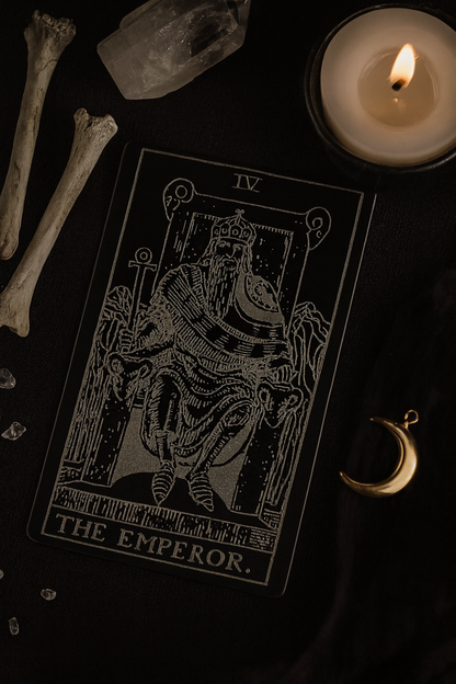 Metal keepsake with The Emperor laser engraved on anodized aluminum, photographed in a mystical dark setting