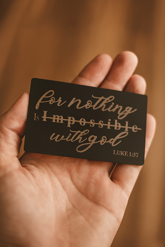 Hand holding a card with 'For nothing is impossible with God' text