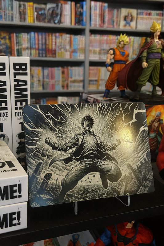 Anime figurines and merchandise on a shelf with a prominent display of an fan art illustration of anime character laser engraved on anodized aluminum 5x7 plaque.