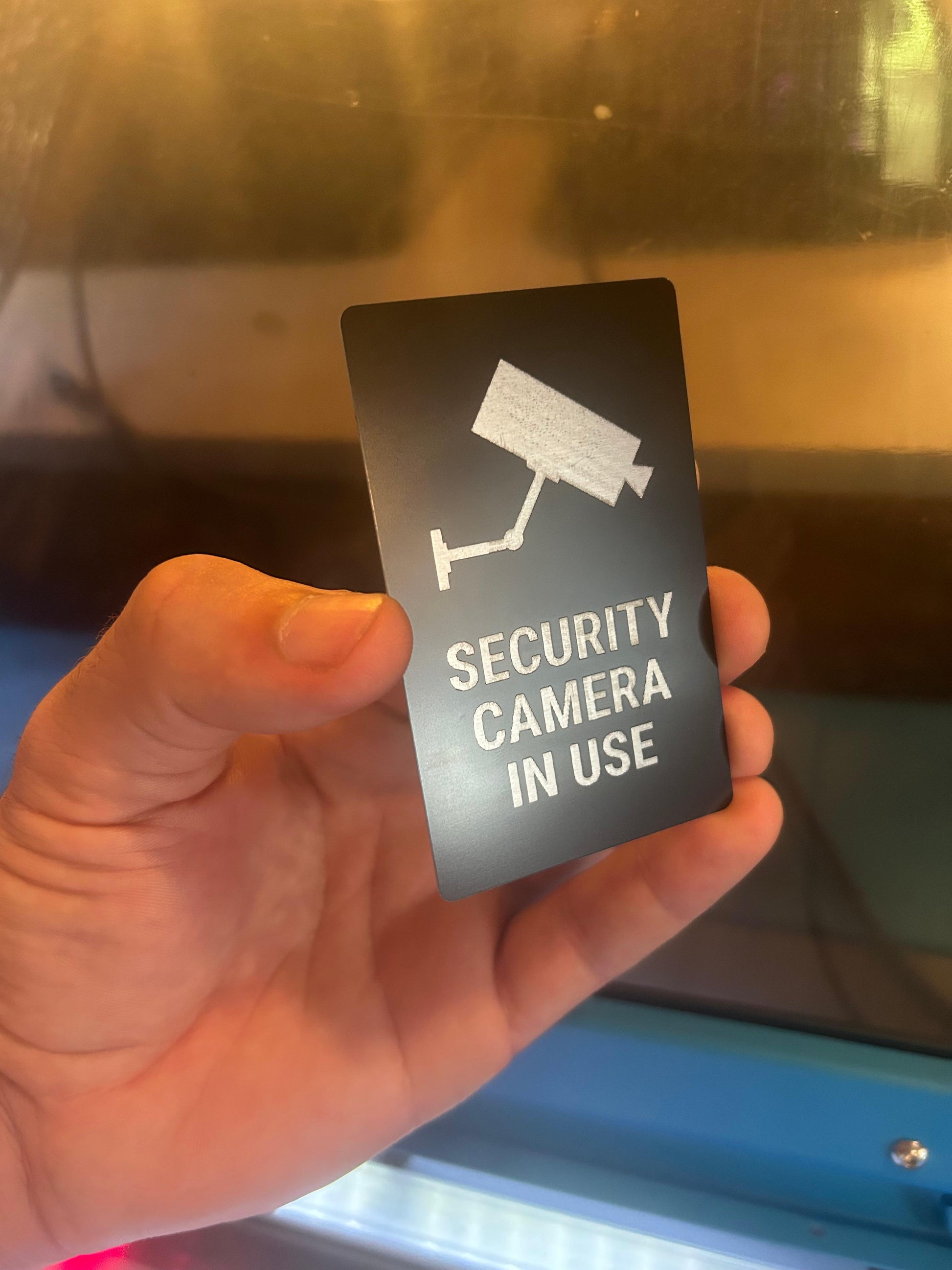 Laser engraved metal placard with Security Cameras In Use text in black/silver