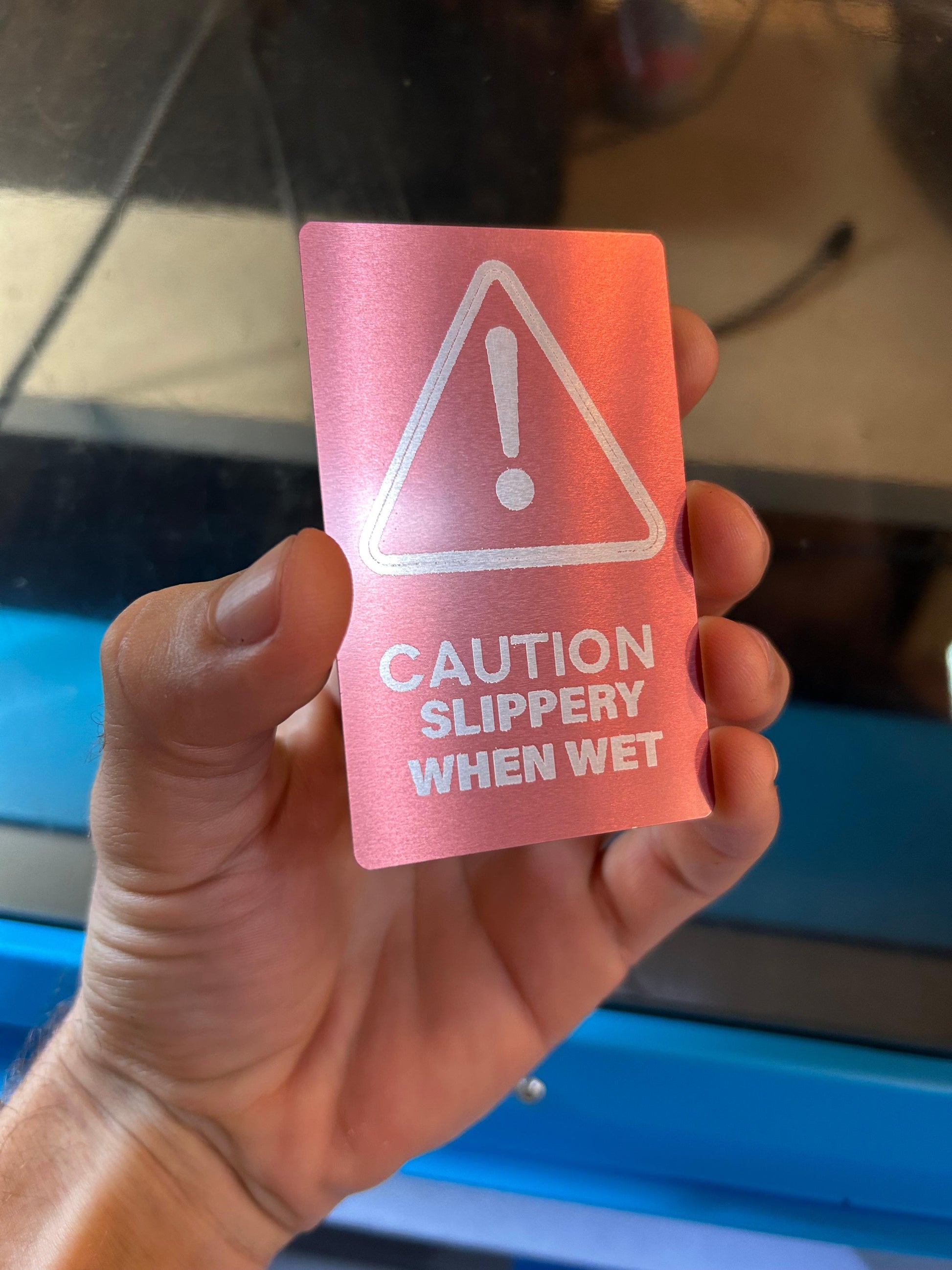 Metal "Slippery When Wet" laser engraved signage