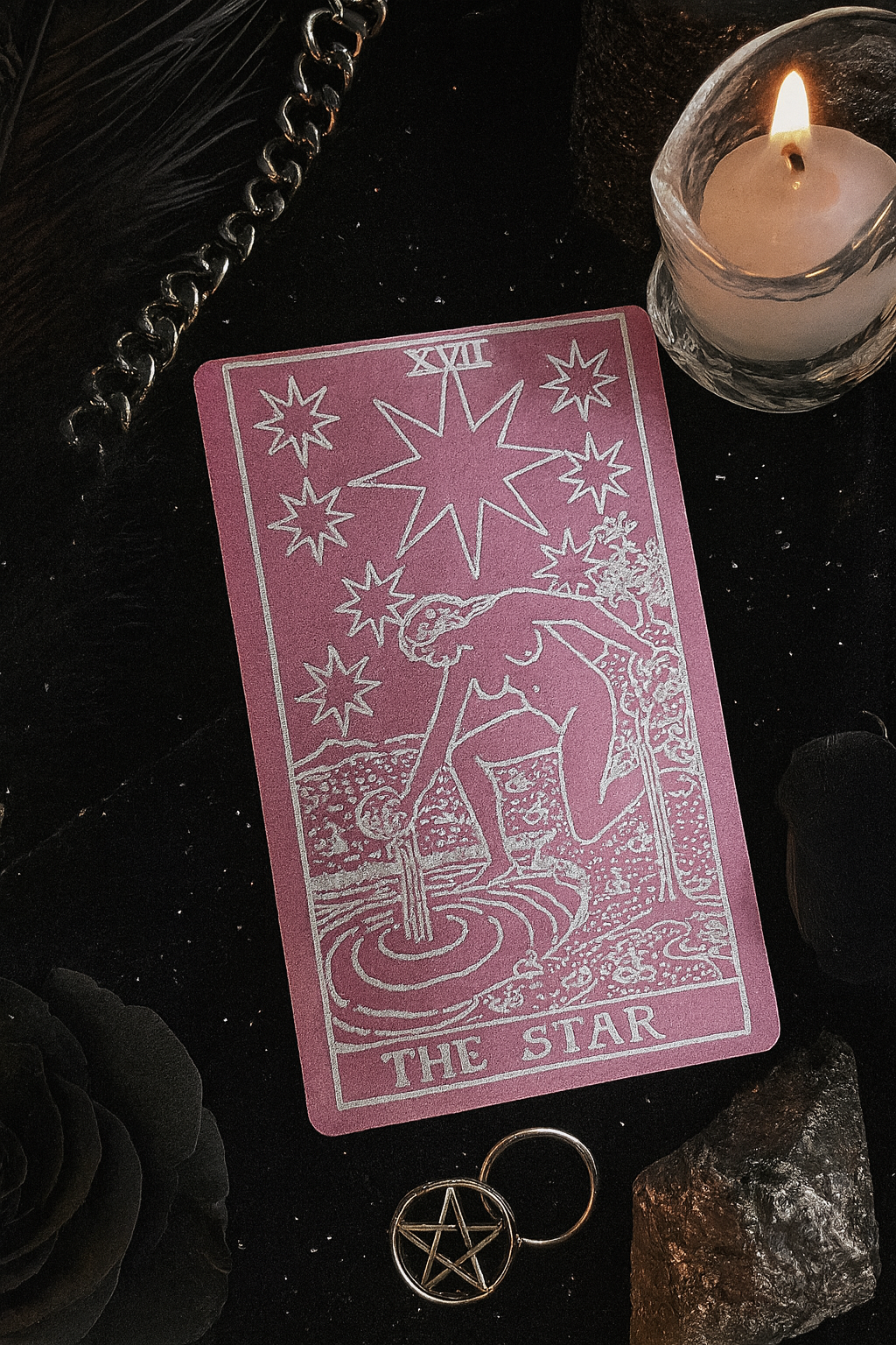 Rose gold/silver tarot card titled 'The Star' with a candle and pentacle on a dark background
