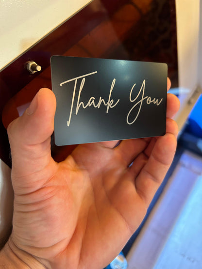 Laser engraved metal "Thank You" card in elegant script font