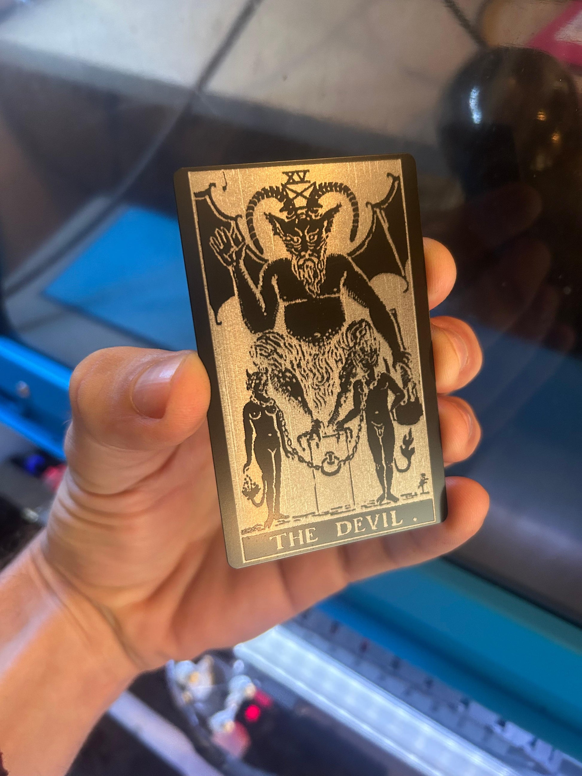 Laser engraved metal tarot card with "The Devil" design