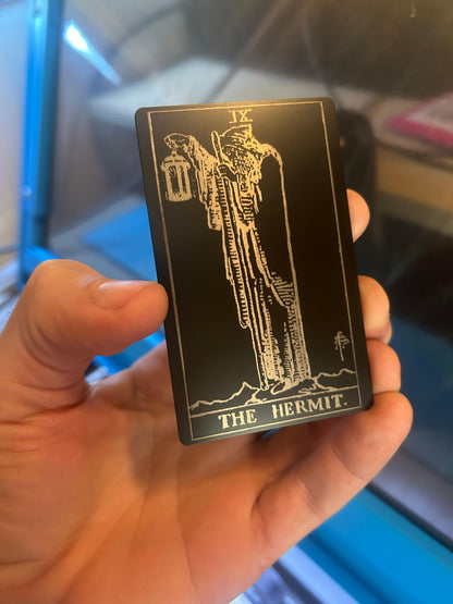 Laser engraved metal tarot card with "The Hermit" design