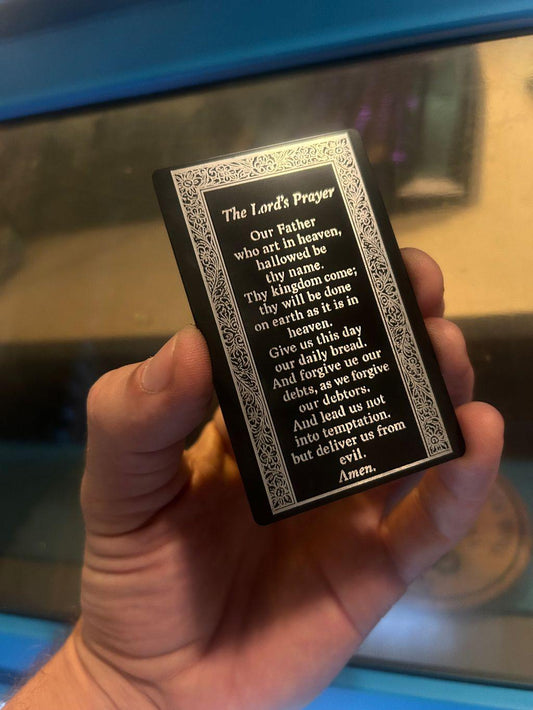 Laser engraved metal prayer card with The Lord's Prayer in black/silver anodized aluminum
