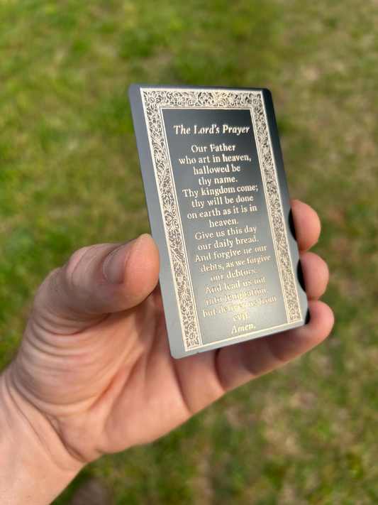 Detailed shot of Christian keepsake metal card featuring engraved The Lord’s Prayer with optional acrylic stand