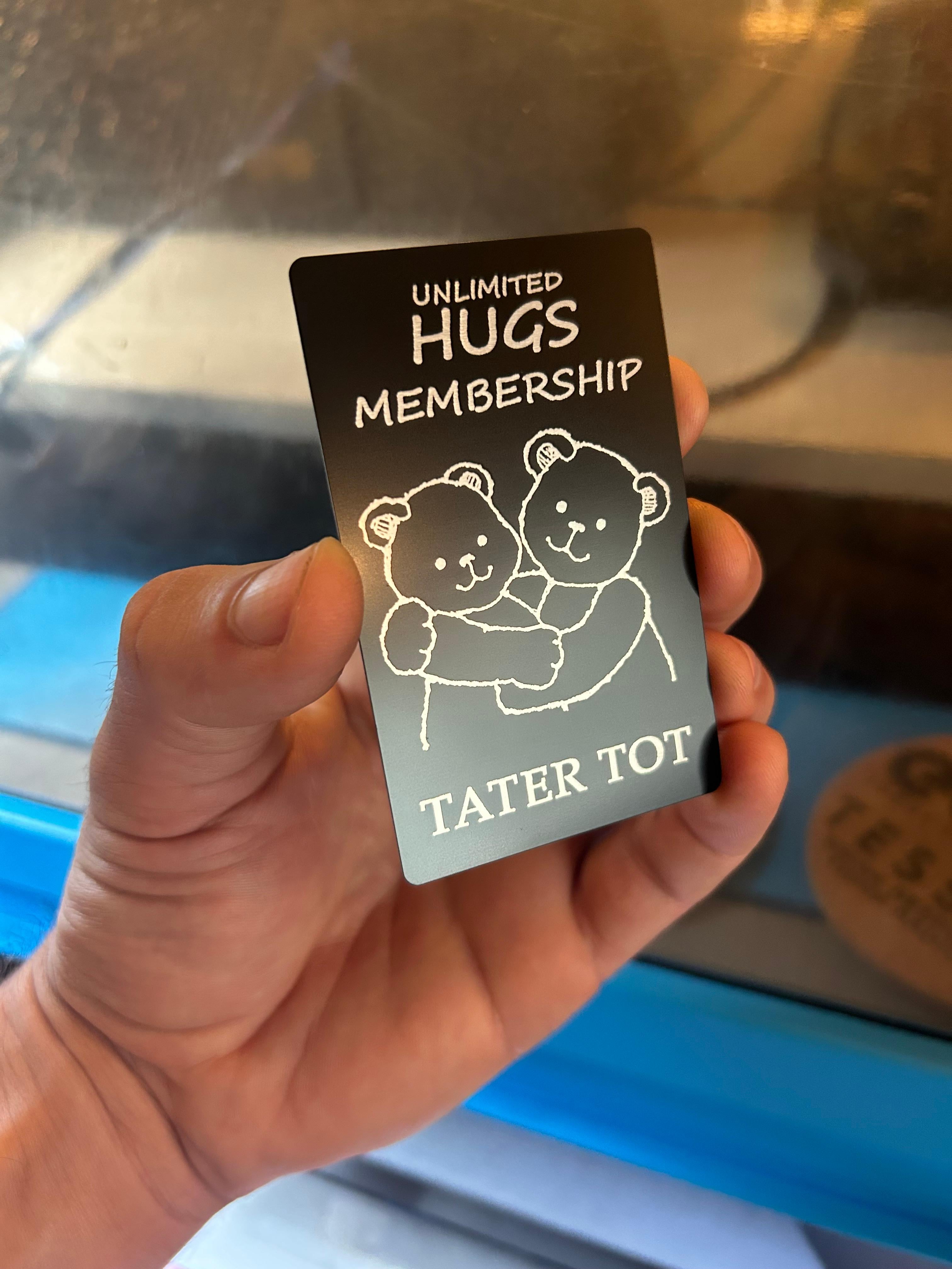Unlimited Hugs engraved metal card