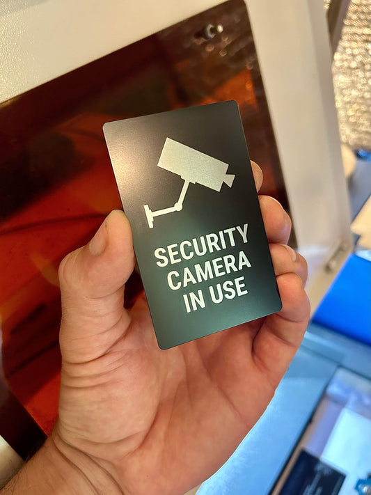 Laser engraved metal video recording notice placard in black/silver anodized aluminum