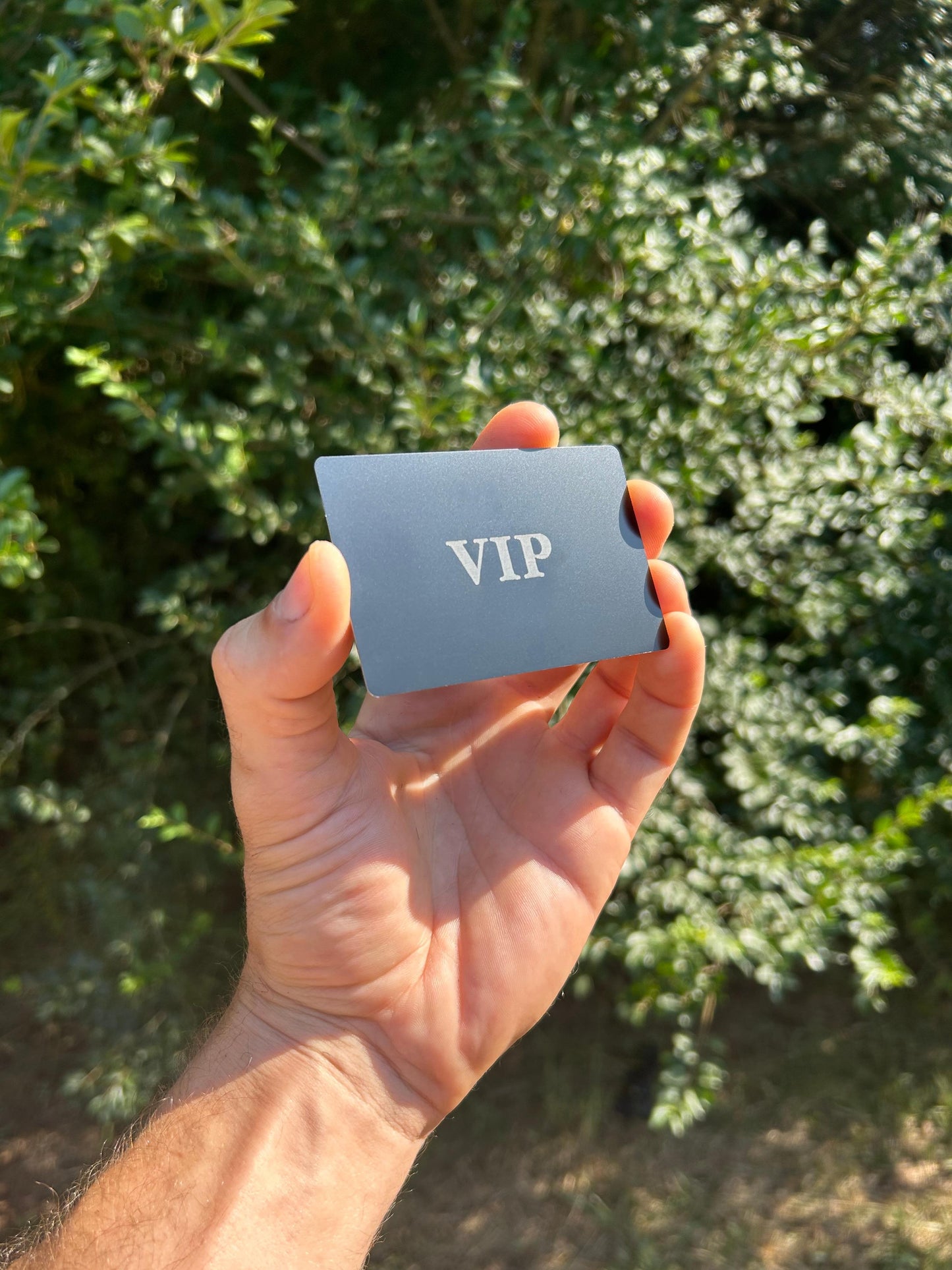 Premium anodized aluminum business card with VIP text laser engraved