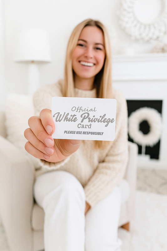 Woman holding an 'Official White Privilege Card' in a cozy indoor setting.